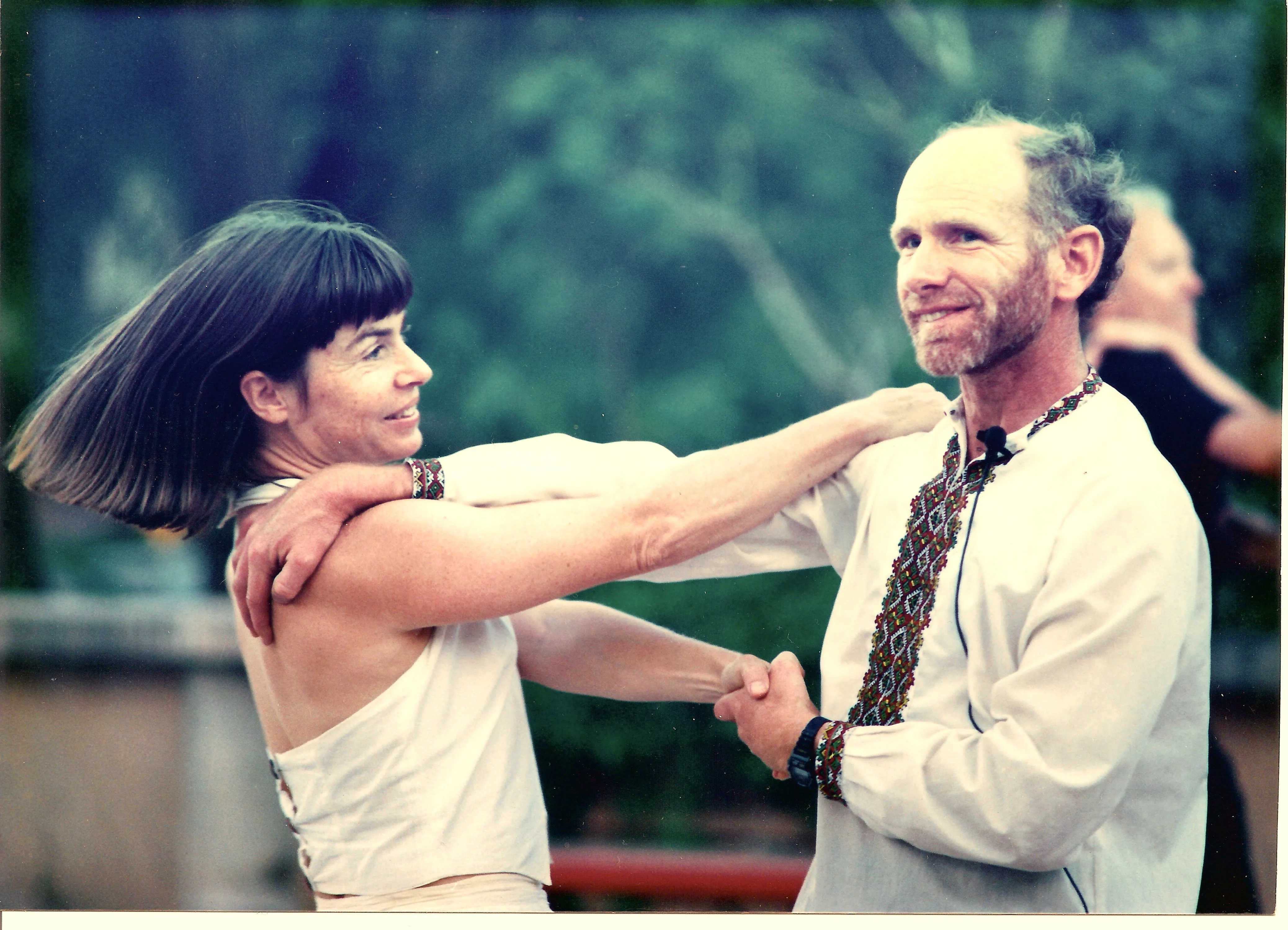 Tom Masterson teaching folk dance with a dance partner.
