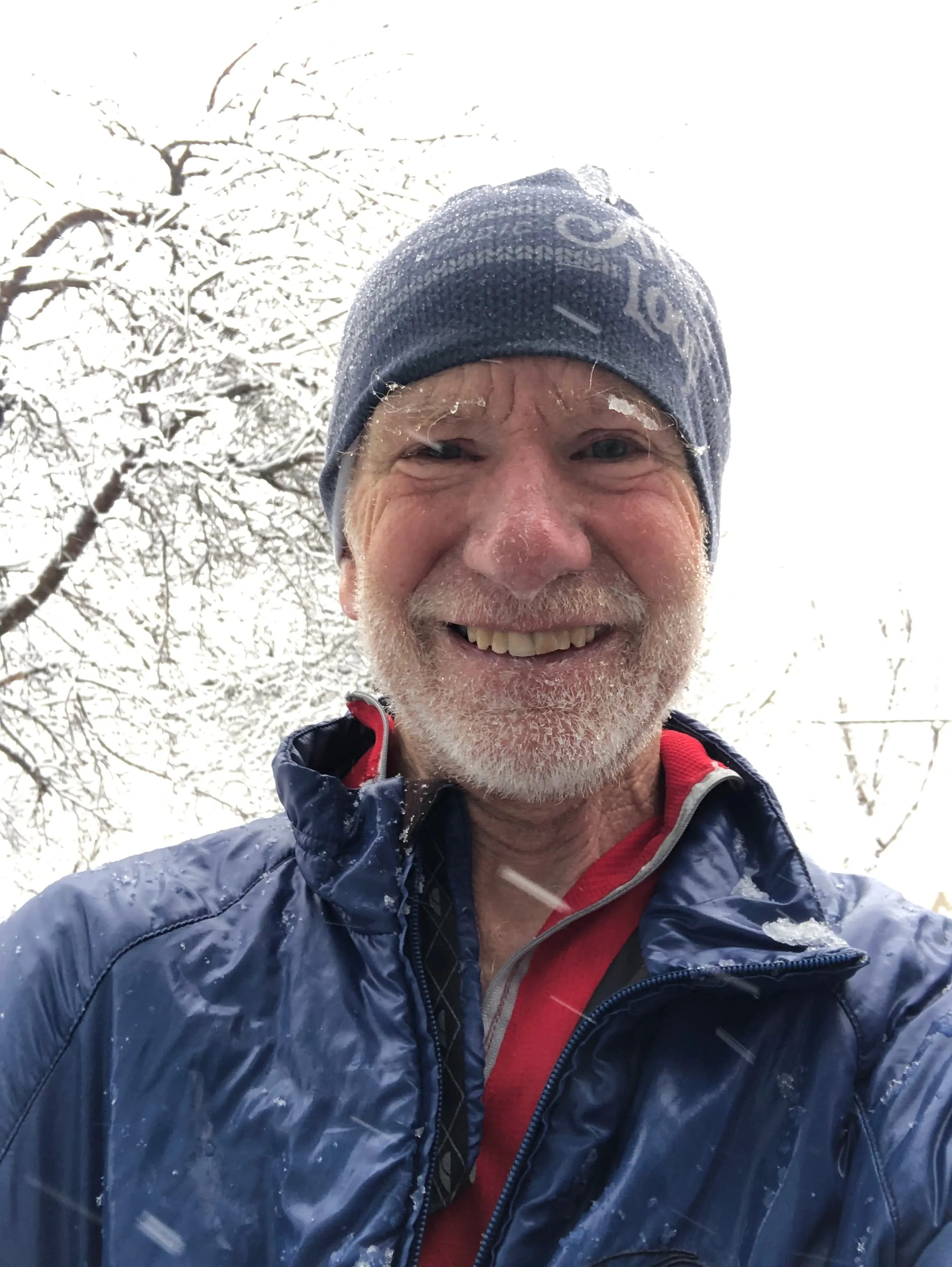 A selfie of Tom Masterson a snowy winter day.